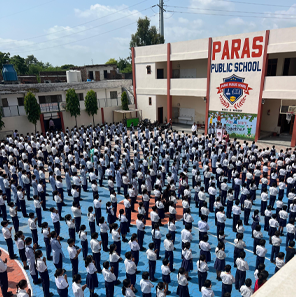 Paras Public School campus exterior with modern architecture and green playground
